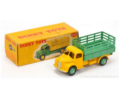 Dinky 343 (30n) Dodge Farm Produce Wagon - two-tone finished in yellow cab and chassis, mid-green stake back and ridged hubs 