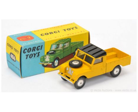 Corgi 406 Land Rover (109WB) - yellow body, black ribbed roof, silver trim, flat spun hubs, with metal tow hook - Excellent (