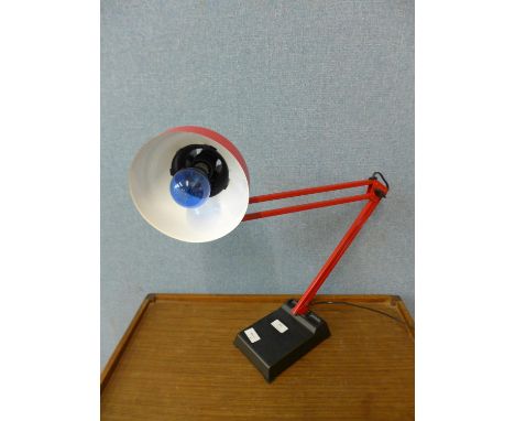 A red metal anglepoise desk lamp 
