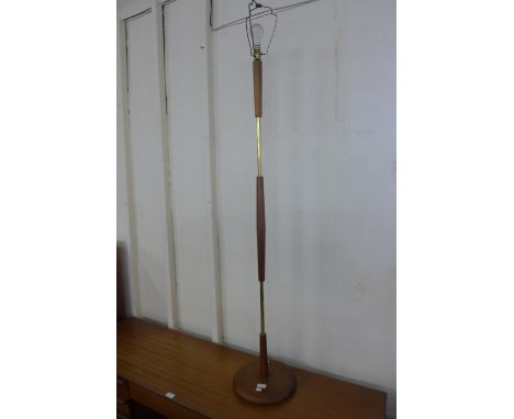 A teak standard lamp 
