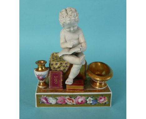 A fine quality Chamberlains Worcester inkwell modelled as a putto seated reading flanked by elaborate vases and volumes of bo