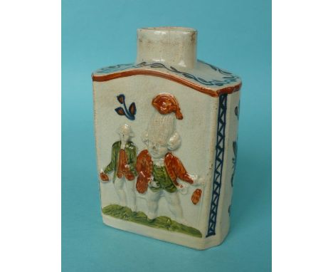 A Prattware tea caddy well moulded with a gentleman and his servant and on the reverse a lady and her maid each with ridiculo