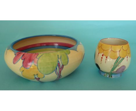 # A Clarice Cliff ‘Bizarre’ cup, 82mm and a bowl, both with hairline cracks (2) 