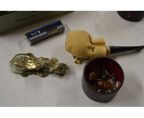 A box of miscellaneous items to include a brass hand letter clip, various shirt studs,a pipe etc.