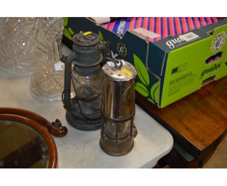 An Eccles miners lamp; together with one other lamp