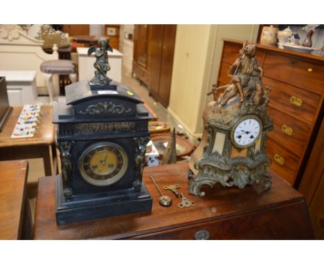 A slate two hole mantel clock decorated with a cherub; together with a gilt metal mantel clock 