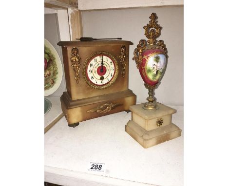 A mantel clock & 1 other item