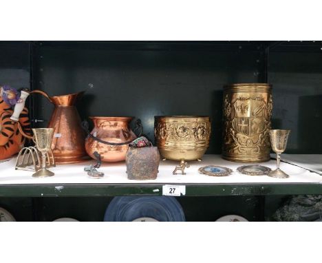 A shelf of copper & brassware