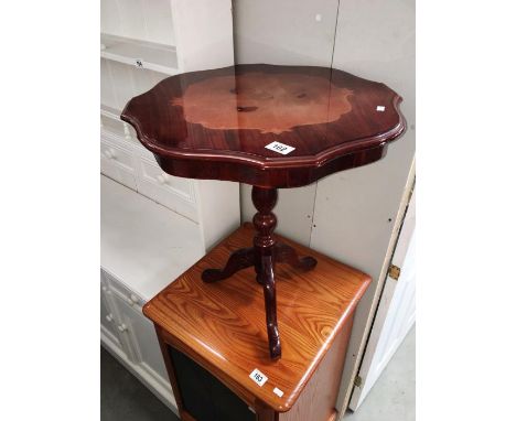 A tripod occasional table