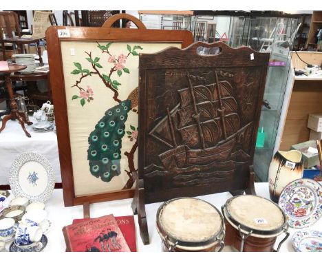 A carved oak fire screen & a tapestry firescreen