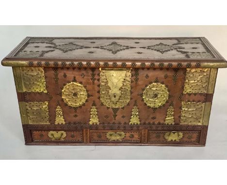 ZANZIBAR TRUNK, early 20th century hardwood and brass mounted with three drawers and rising lid, 133cm W x 70cm D x 57cm H. 
