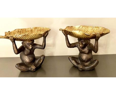 TRINKET DISHES, pair, 33cm H x 40cm W x 18cm D, each in the form of a monkey holding aloft a banana leaf. 