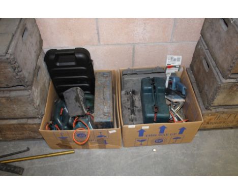 Two boxes of various power tools 
