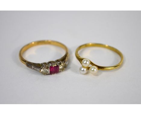 A three stone ruby and diamond ring, yellow metal set to/w a 9ct yellow gold ring set three small pearls, both size K (2)