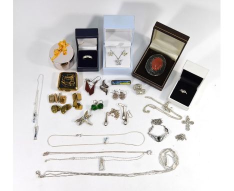 A small collection of various white metal jewellery including nine necklace chains, some with pendants, drop earrings, cuffli