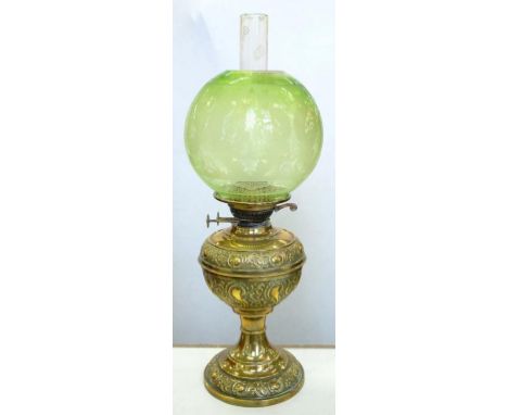 A VICTORIAN EMBOSSED BRASS OIL LAMP WITH CONTEMPORARY GLOBULAR GREEN SHADED AND ETCHED GLASS SHADE, 49CM H, C1890