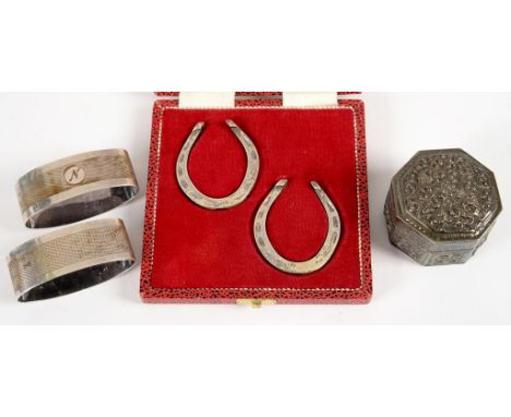 A PAIR OF GEORGE V SILVER NAPKIN RINGS, ENGINE TURNED, BIRMINGHAM 1919 AND 1920, A PAIR OF ELIZABETH II SILVER BRIDAL HORSESH