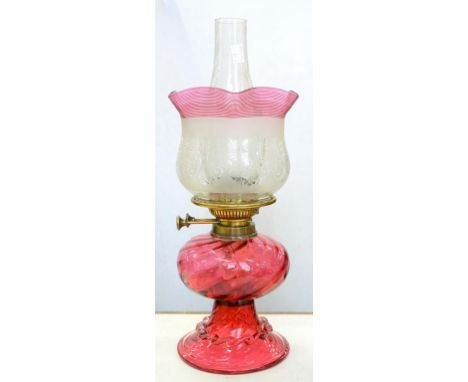 A VICTORIAN WRYTHEN FLUTED AND TRAILED CRANBERRY GLASS OIL LAMP OF BELL SHAPE, WITH BRASS BURNER, CONTEMPORARY CRANBERRY TRAI