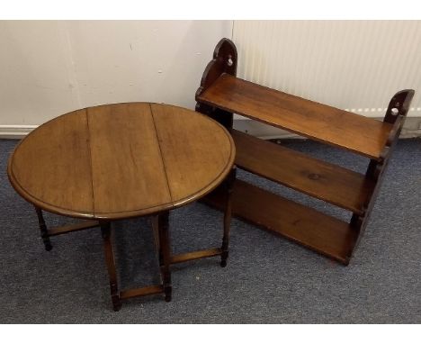 A small mahogany oval spider leg table, turned and squared supports, 66 cm wide x 52 cm deep x 47 cm high extended. Together 