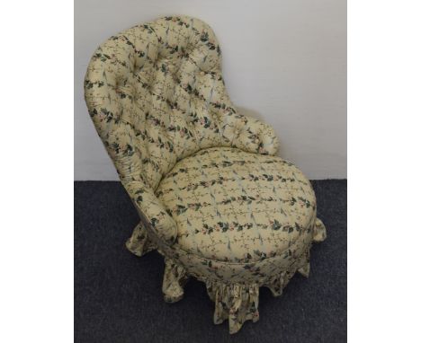 An Edwardian floral button backed nursing chair 