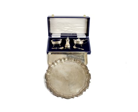 A 20th Century silver salver, Sheffield 1960, Walker &amp; Hall, 21 cm diameter, together with a condiments set, Birmingham 1