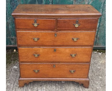 An antique oak chest-of-drawers, two short over three graduated long drawers, bracket feet, in two sections, 94 cm wide x 50 