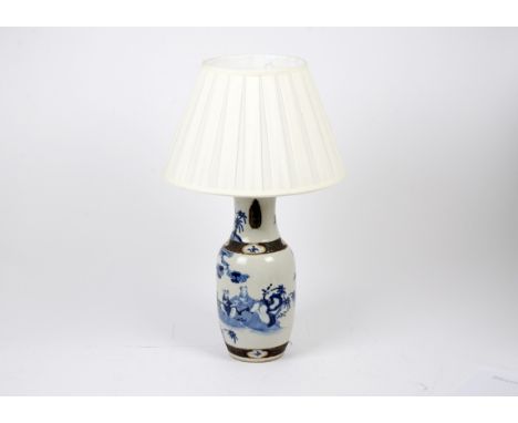 A Chinese porcelain blue and white painted lamp, decorated with applied bronze decoration and painted figures in a garden, cr