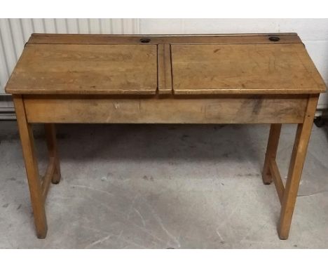 A vintage oak double school desk, two lift-up lids and inkwell holes, 102 cm x 43 cm x 72 cm