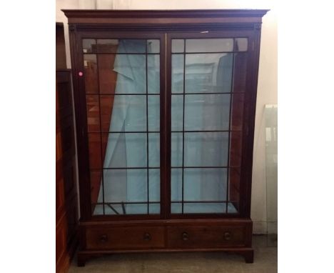 A 19th Century mahogany large two section glazed display cabinet, two glazed panel doors revealing wooden and glass shelves, 