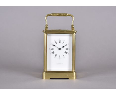 An Edwardian brass repeater carriage clock, by Schwarck, brass case, white enamel face, Roman numerals, 15 cm high