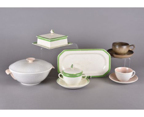 A collection of Poole pottery two tone dinner services, in pink and grey, together various coffee cans and saucers and other 