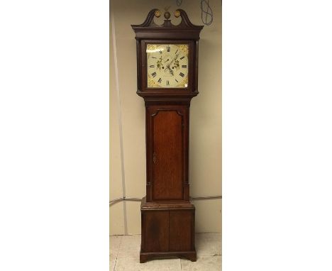 A 19th Century oak and mahogany longcase clock by J. Jones of Carnarvon, eight day movement, square dial, bird decorated chap