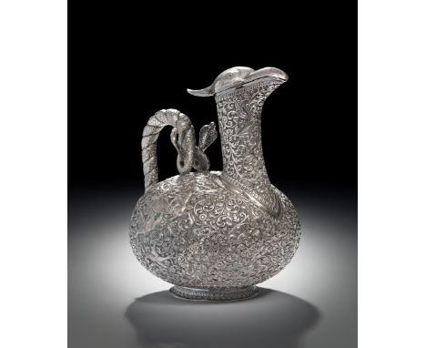 A fine silver ewer from Bhuj, India, circa 1890, exquisitely crafted in repousse and chased silver, featuring a stylised bird