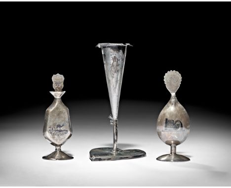 A GROUP OF IRAQI SILVER AND NIELLO CONSIST OF CANDLESTICK AND TWO DISPENSERS, 20TH CENTURY     Tallest: 11.3cm, Total weight:
