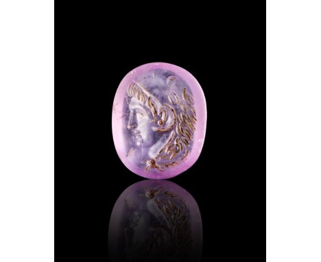 A ROMAN AMETHYST STONE INTAGLIO DEPICTS A YOUNG DEITY, 1ST - 2ND CENTURY A.D L: 1.7cm  