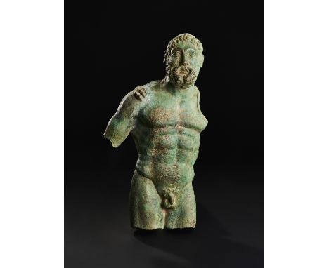 This striking fragmentary bronze statue depicts the powerful figure of Hercules, one of the most celebrated heroes of Greco-R