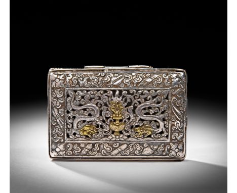 The lid is adorned with an intricate relief composition, where a pair of sinuous dragons flank a central floral emblem, symbo