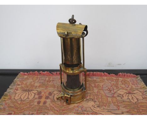 A Routledge and Johnson miners lamp by Thomas & Williams (Aberdare) with side latch lock
