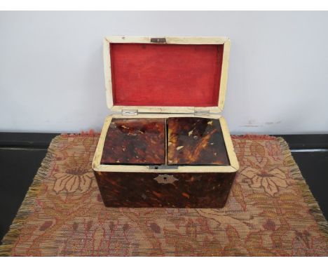 A Georgian tortoiseshell twin compartment tea caddy, 18cm long