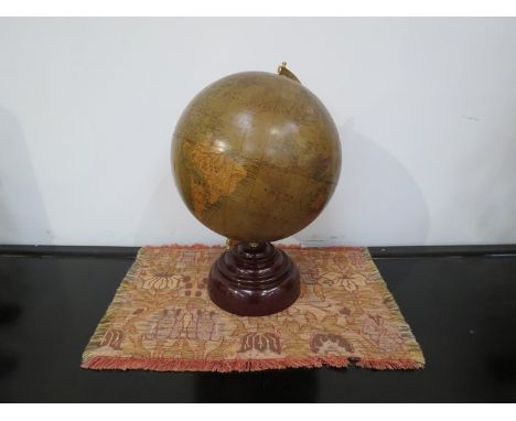 A late 19th/ early 20th Century Philip's 9" terrestrial globe on a later Bakelite effect stand, 34cm tall