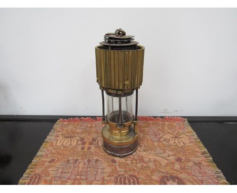 A Patterson miners lamp with corrugated bonnet