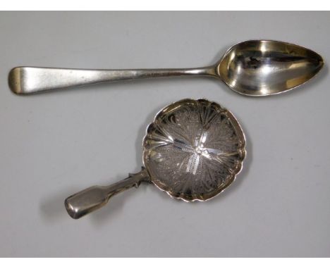 An 1864 Birmingham silver caddy spoon by Hilliard &amp; Thomason twinned with a silver teaspoon with rubbed marks, 20.2g tota