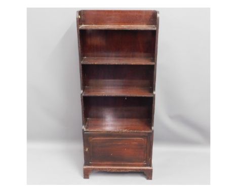 A small book shelf with cupboard under, 43in high x 18in wide