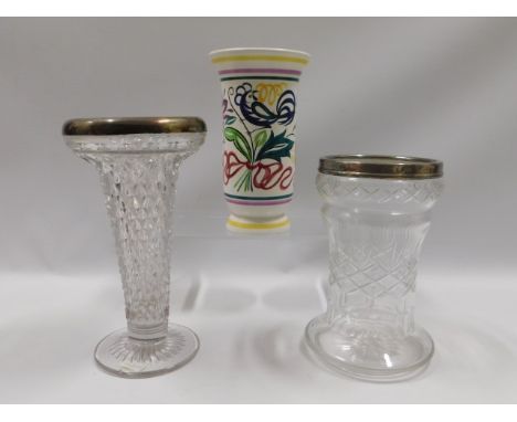 Two silver rimmed cut glass flower vases twinned with a floral Poole pottery vase