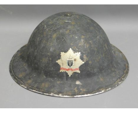 A vintage Fire Brigade helmet