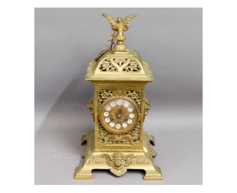 A decorative brass clock, 16.5in tall