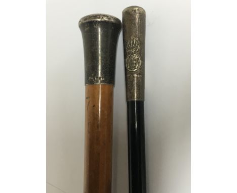 A White metal Milatry swagger stick possible Highland light Infantry and one other silver walking stick (2)