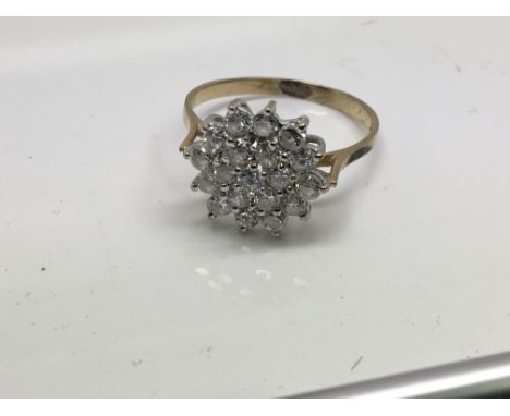 A 9ct yellow gold cluster ring set with CZ stones, 