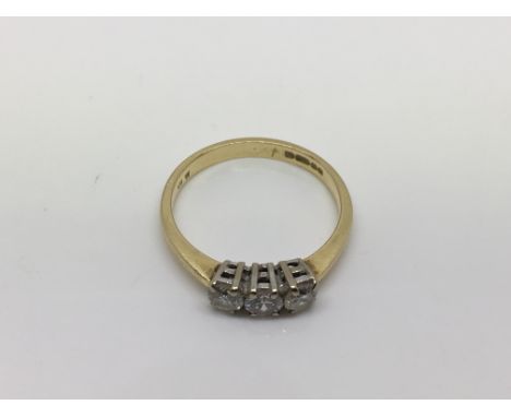 An 18ct gold three stone diamond ring, approx 1/2ct, size L-M and approx 3g.