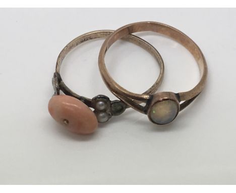 A gold ring inset with an opal and one other vintage coral and seed pearl ring (2) 